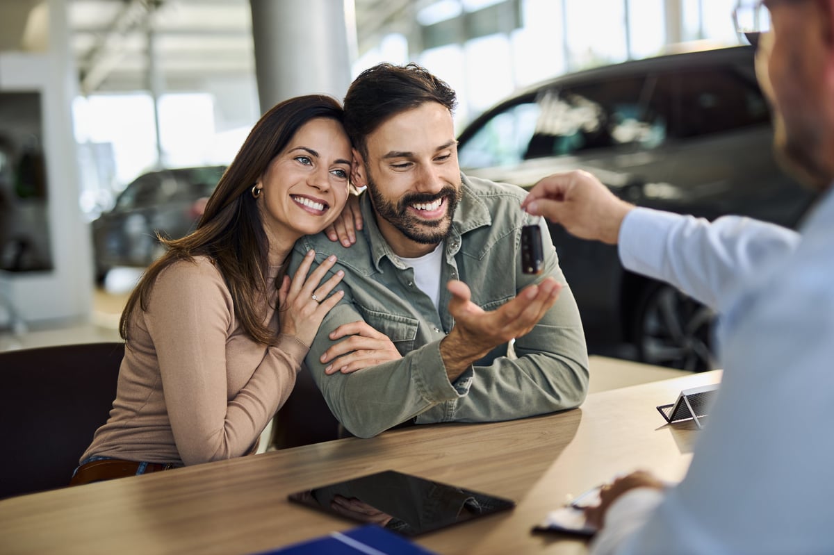 Customer receiving keys to their new car